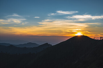 Beautiful Sunset view and layers mountains on khao khao chang phueak mountian.Thong Pha Phum National Park's highest mountain is known as Khao Chang Phueak