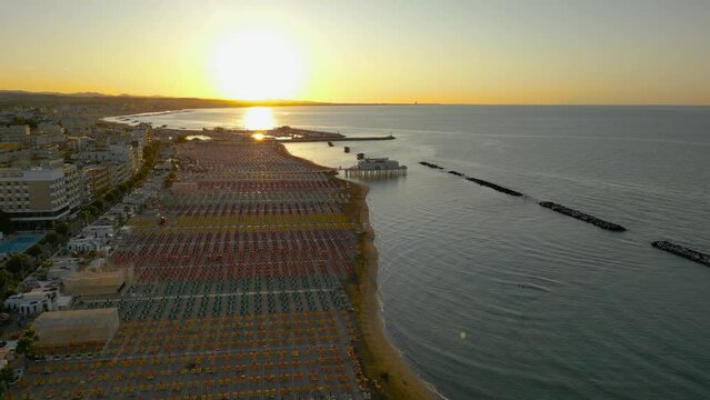 4k aerial footage of the beautiful Gabicce Mare at sunset with the entire Romagna Riviera from Cattolica, Misano, Riccione to Rimini