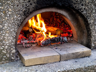 Fire burning in red oven