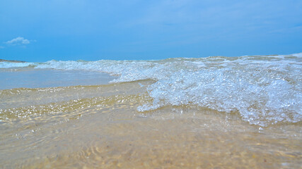 Summer water waves on the paradise beach.