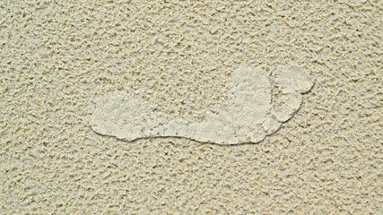 Footprint on summer beach sand in vacation.