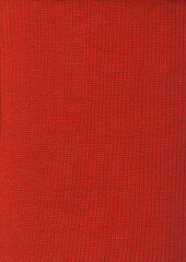 Red wool knit fabric background texture. Monochrome color knitted sweater, scarf or cozy winter...