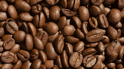 background of roasted coffee beans close-up. selective focus