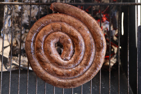 Boerewors sausages on grill. South African braai 