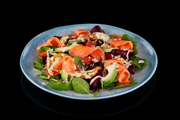 salad with vegetables and red fish