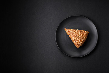 Delicious sweet puff waffle cake with cream and nuts cut into pieces