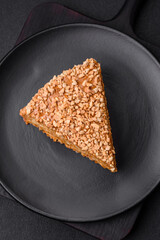 Delicious sweet puff waffle cake with cream and nuts cut into pieces