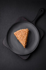 Delicious sweet puff waffle cake with cream and nuts cut into pieces