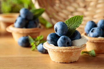Small tartlets with fresh blueberries and mint.