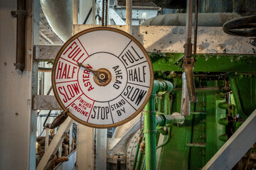 telegraph controls in engine room of a vintage steamship - obrazy, fototapety, plakaty