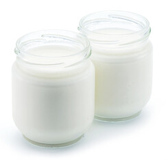 Two jars of homemade organic yoghurt isolated on white background.