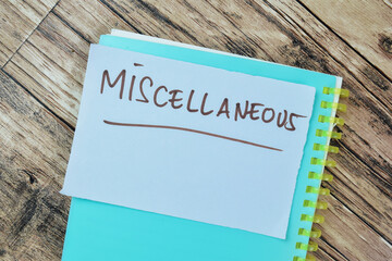 Concept of Miscellaneous write on sticky notes isolated on Wooden Table.