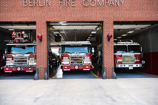 Berlin Fire Company. Fire station in a small town Berlin in Maryland USA. Three fire trucks are in the open garage.