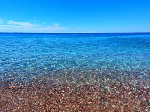 Blue sea and beautiful pebbly beach.