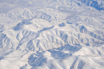 Fototapeta premium Aerial view of snow-capped Taurus mountains in Turkey
