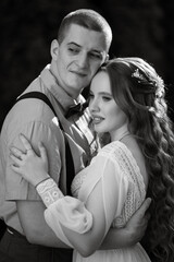 wedding walk of the bride and groom in a coniferous