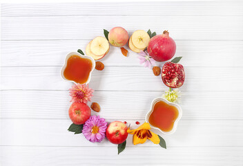 Autumn banner with honey, apples, pomegranates, flowers, dried fruits on light background with place for text, composition for jewish holiday Rosh hashanah, hello autumn and thanksgiving day concept, 