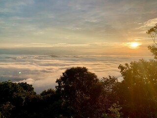 Sunrise at Doi Samerdao cloudy skies with sea of fog. Nan, Thailand.
