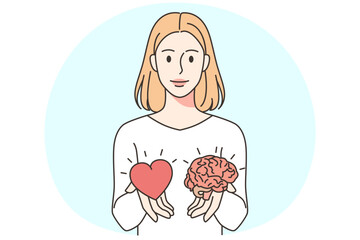 Woman holding heart and brain