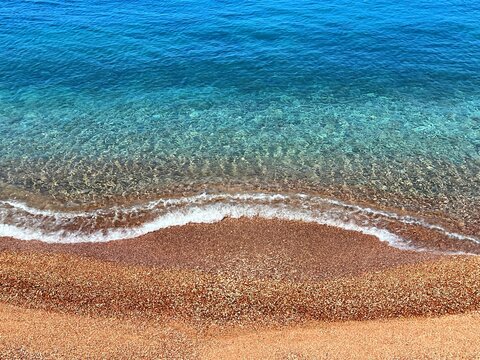 Sea wave vivid blue water golden sand paradise beach.
