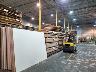 Loader in a hardware store in a chipboard warehouse. 