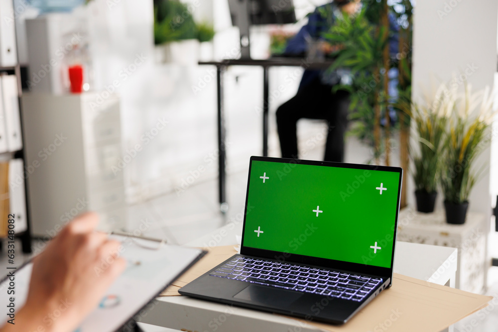 Poster executive manager planning company budget and using laptop with chroma key screen. entrepreneur anal