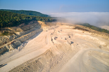 Aerial view of open pit mining site of limestone materials extraction for construction industry...