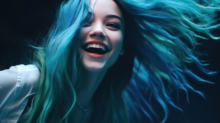 Fototapeta premium Portrait of a beautiful young woman with blue hair and flying hair