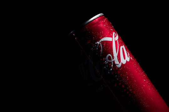 The Coca Cola drink on a black background, details, close up, editorial
 07.28.2023