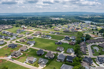 Stunning areal view of Twin Creeks Village next to Tims Ford Lake with the Cumberland Mountains in...