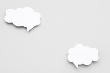 Blank speech bubbles on grey background