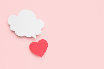 Paper heart with blank speech bubble on pink background