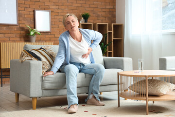 Mature woman having heart attack at home