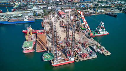 Aerial view of oil platforms anchored in the city harbor for repair