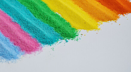 Close-up of rainbow colored sand streaks in vivid colors in high resolution and sharpness