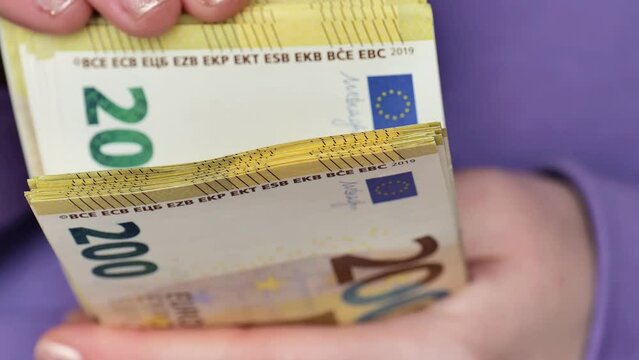 Euro currency banknotes pack. Cash payments in EU countries.Two hundred euro pack in female hands close-up.4k footage
