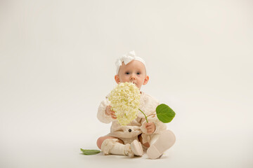 portrait of a small child for advertising a product of a service. a beautiful one-year-old child on a white background isolated