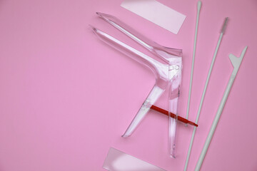 Sterile gynecological examination kit on pink background, flat lay. Space for text