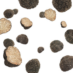 Cut and whole truffles falling on white background