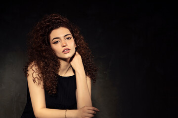 Portrait photos of a young, beautiful, white-skinned and red-haired girl, headshot. Portrait, headshot photos of a young and talented actress candidate, taken on a black background