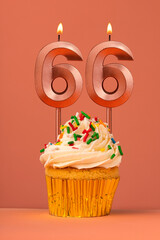 Birthday cake with candle number 66 - Coral fusion background