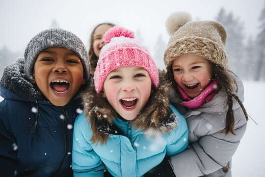 A group of children playing in the snow, laughing and having fun