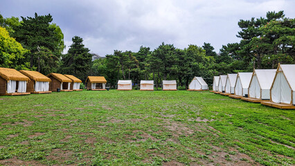 Fototapeta na wymiar Tents in the campsite - Landscape of Nanhu Park, Changchun, China in summer