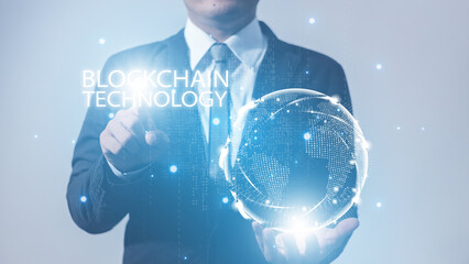 businessman holding global network connection and touch hologram blockchain digital technology.