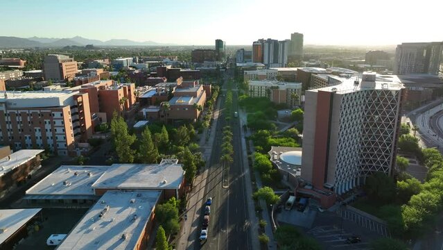 Arizona State University campus in Tempe, AZ. Aerial establishing shot of buildings during sunset.