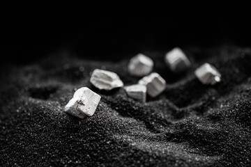 Pure silver or platinum or rare earth from the mine that was placed on the black sand