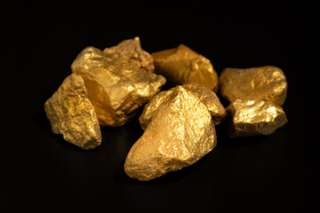 The pure gold ore found in the mine on black background