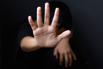 Close up of kid hand doing stop gesture. Stop human abuse. Stop child abuse