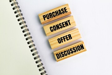 wood with the words how to buy something discussion, offer, consent and purchase. purchase concept....