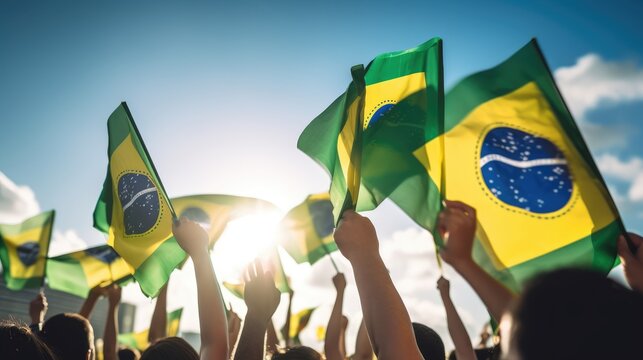 Lifting Brazilian Flags: Back view group of People Holding Brazilian Flags,